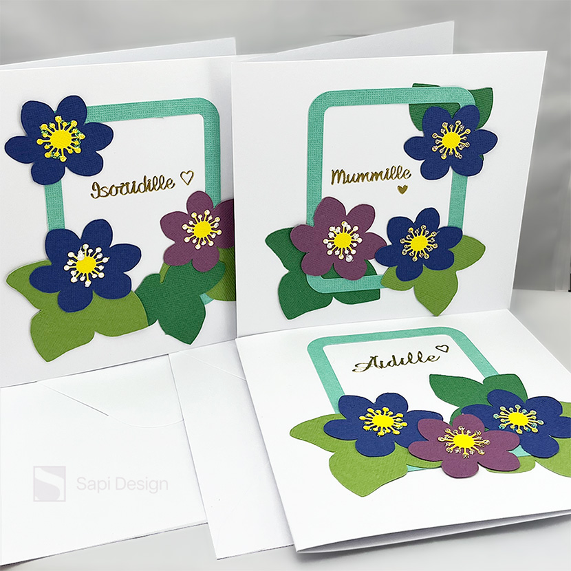 Sapi Designin suunnittelema ja elektronisella leikkurilla valmistama sinivuokkoaiheinen äitienpäiväkortti